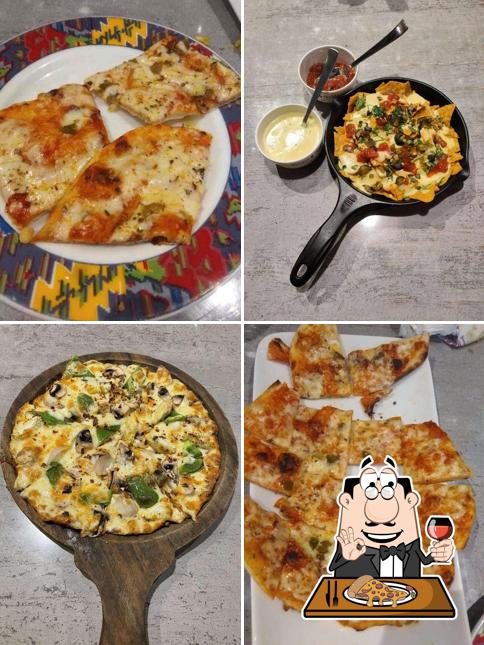 Try out pizza at Kailash Parbat