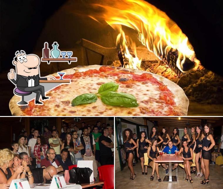 Dai un’occhiata alla foto che presenta la interni e pizza di Jolly Bar