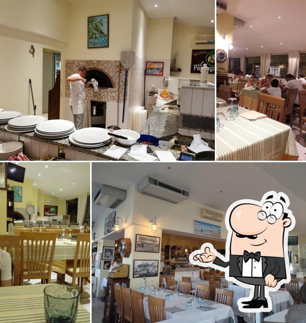 Siediti a un tavolo di Pappagallo Ristorante Pizzeria