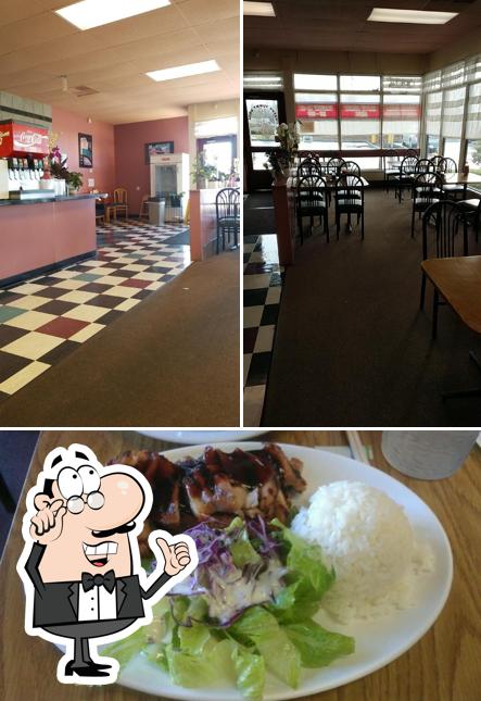 The photo of interior and food at Happy Tummy Grill