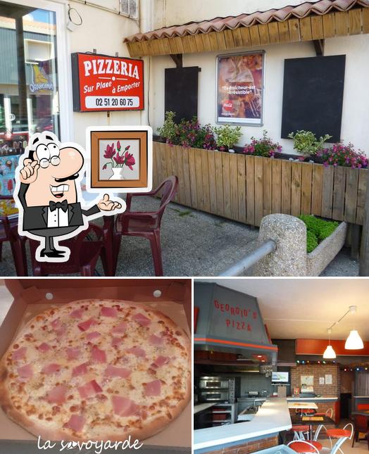 L’image de la intérieur et pizza concernant Georgio's Pizza