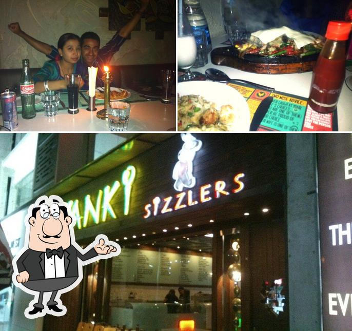 Take a look at the image showing interior and beer at Yanki Sizzlers