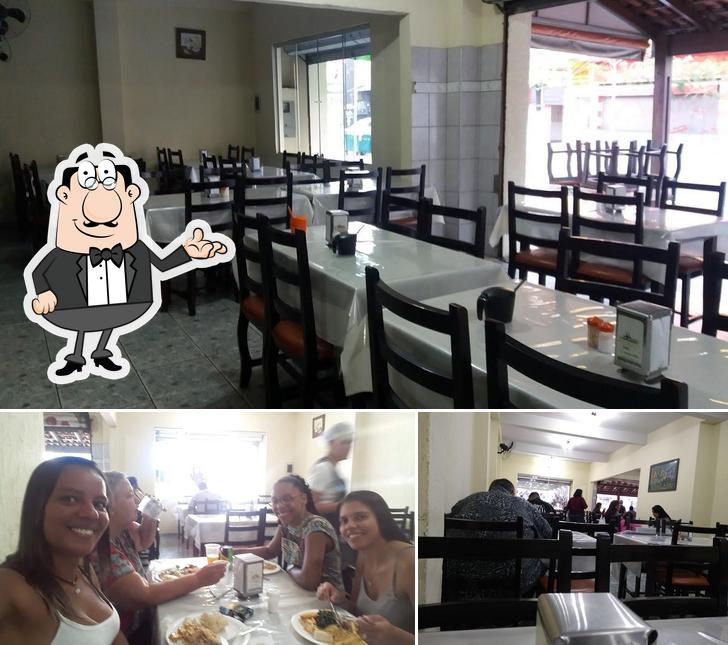 Esta é a imagem mostrando interior e mesa de jantar a Restaurante Sabor & Art / O Caiçara