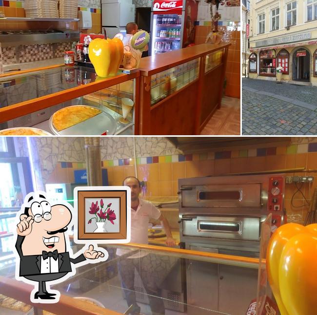 The photo of interior and exterior at Pizza U Radnice