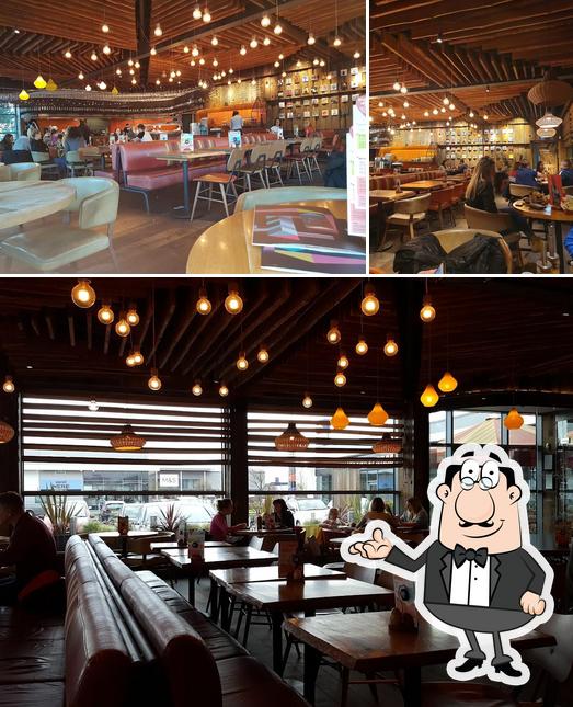Take a seat at one of the tables at Nando's Newport - Retail Park