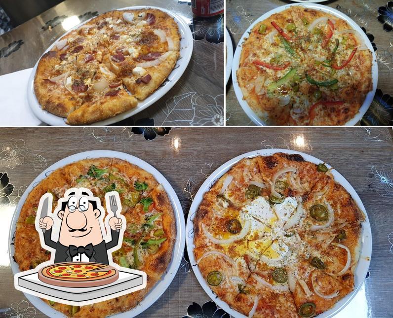 A Pizzeria Aland, vous pouvez prendre des pizzas