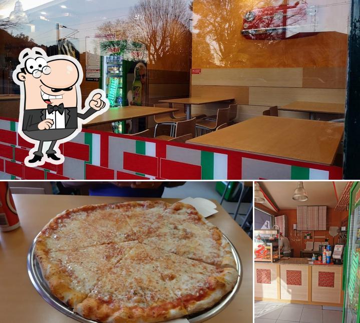 Это фото, где изображены внутреннее оформление и пицца в Mr.Pizza