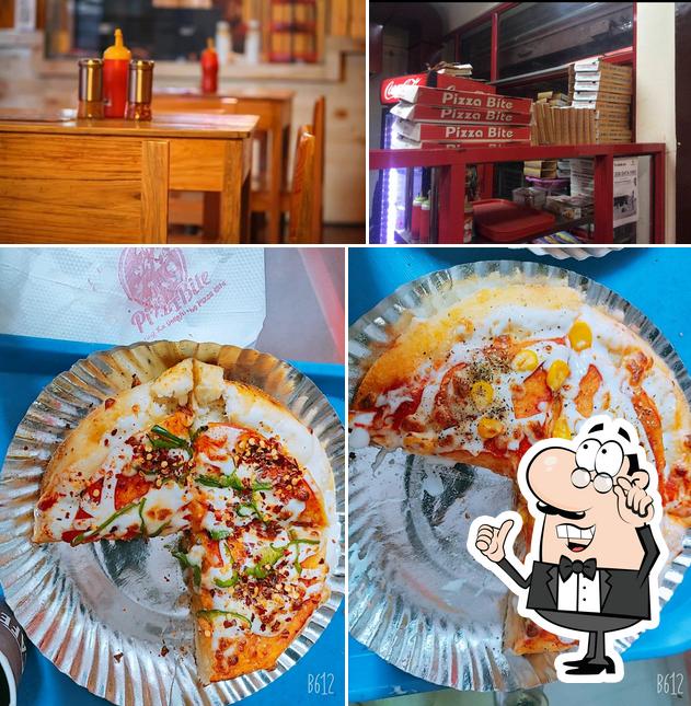 This is the picture displaying interior and food at Pizza Bite