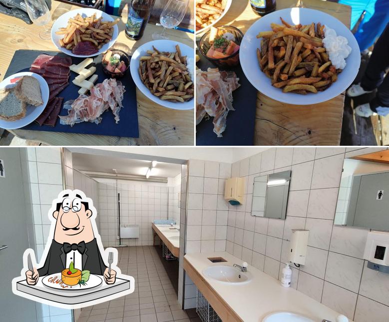 Guarda la foto che raffigura la cibo e interni di Restaurant und Camping Muntanela Radons