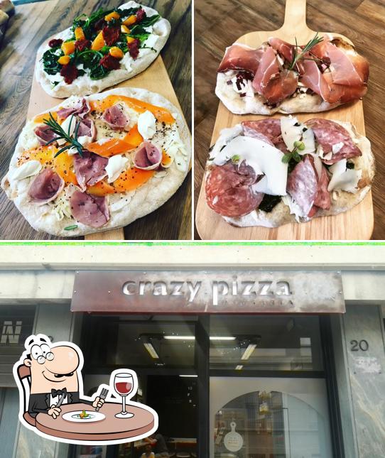 Guarda la foto che presenta la cibo e esterno di Crazy Pizza