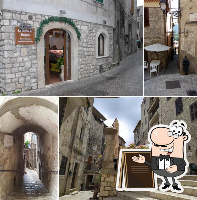 Puoi goderti l'aria fresca da seduto all'esterno di La Taverna del Brigante