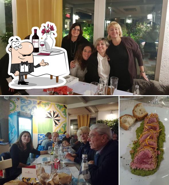 La foto di tavolo da pranzo e cibo da Ristorante Barbarossa