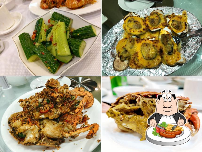 Caracoles y alitas de pollo en 威龍海鮮酒家 Wai Lung Seafood Restaurant