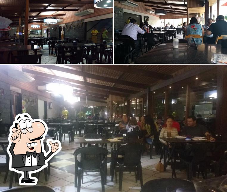 O interior do Pizzaria Dogão