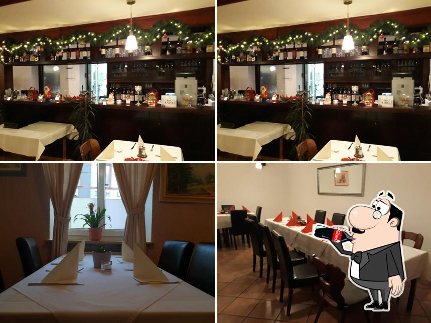 This is the photo depicting drink and interior at Hotel & Restaurant Stern Seckenheim