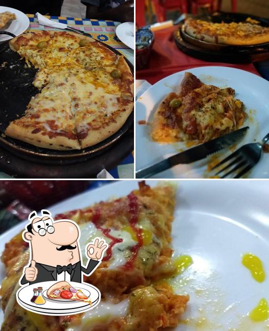 Escolha pizza no Pizzaria Aconchegos