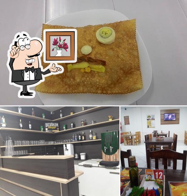 A imagem da interior e comida no Pastelaria Fino Sabor