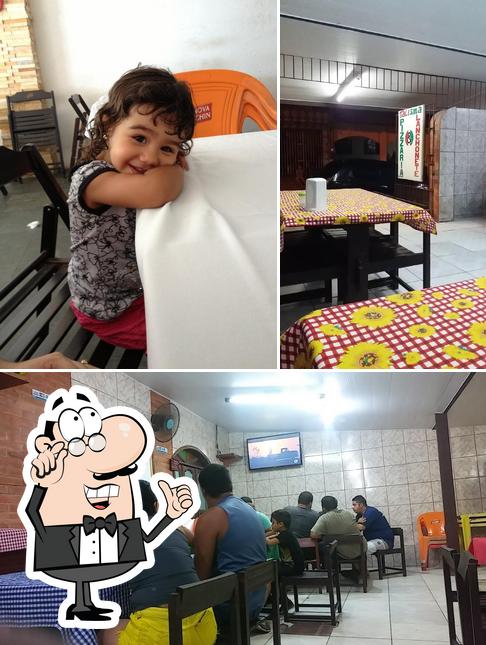 O interior do Pizzaria Romana