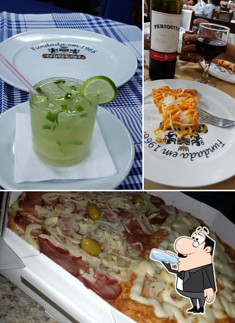 Dê uma olhada a foto apresentando bebida e comida no Pizzeria Cento e Dez