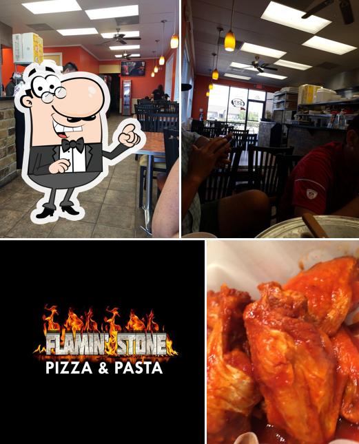 Take a seat at one of the tables at Flamin' Stone Pizza & Pasta