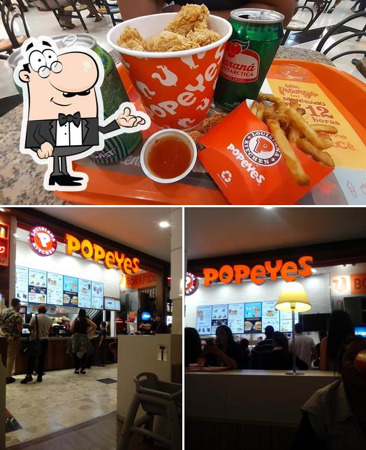 Dê uma olhada a ilustração mostrando interior e bebida no Popeyes Louisiana Kitchen