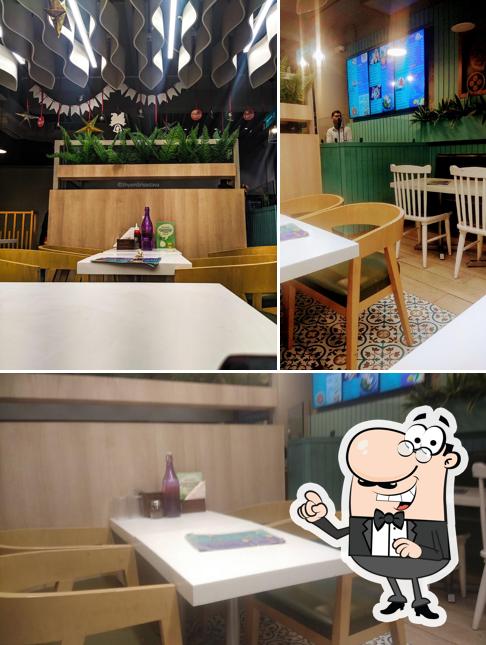 Take a seat at one of the tables at Brijwasi Sweets