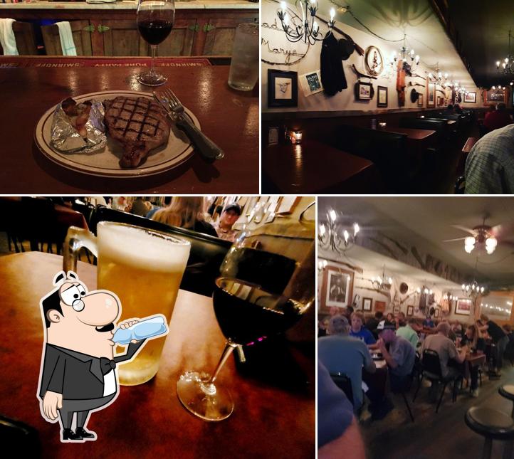 Check out the image displaying drink and dining table at Mad Mary's Steakhouse & Saloon
