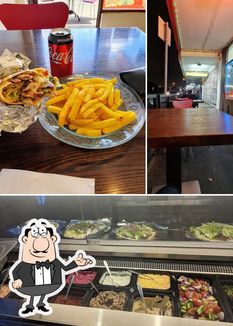 Take a look at the photo displaying interior and food at Flaming Kebabs & Grill
