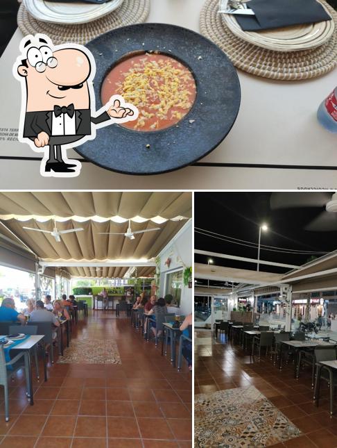 Take a look at the image depicting interior and food at Puerta del mar San José Almeria