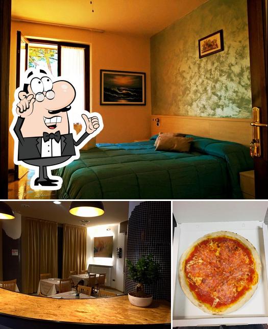 Dai un’occhiata alla foto che raffigura la interni e pizza di HotelRenata&Apartments