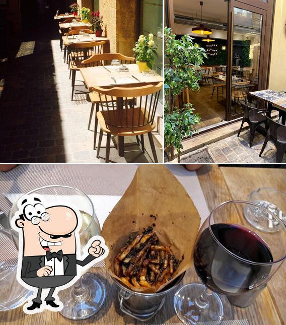 Among various things one can find interior and wine at Restaurant Comptoir Marie-Georgette