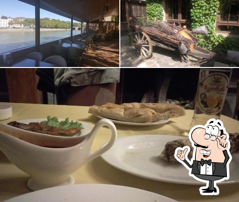Take a look at the photo displaying interior and food at Dzveli Sakhli