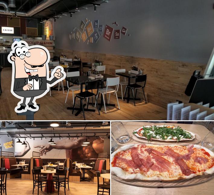 La foto di interni e pizza da Pz Pizza