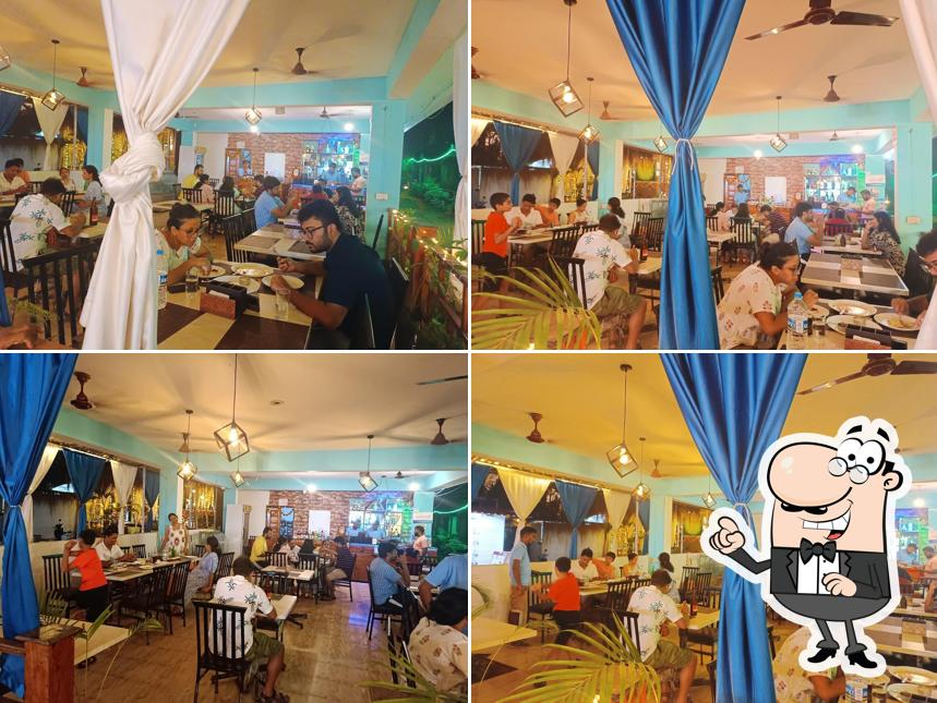 Take a seat at one of the tables at THE SINGH'S FAMILY MULTICUISINE AC RESTAURANT & BAR