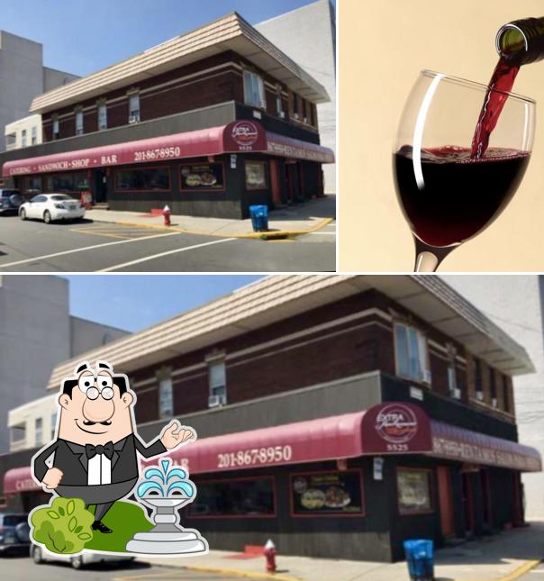 This is the image showing exterior and wine at Extra Super Restaurant
