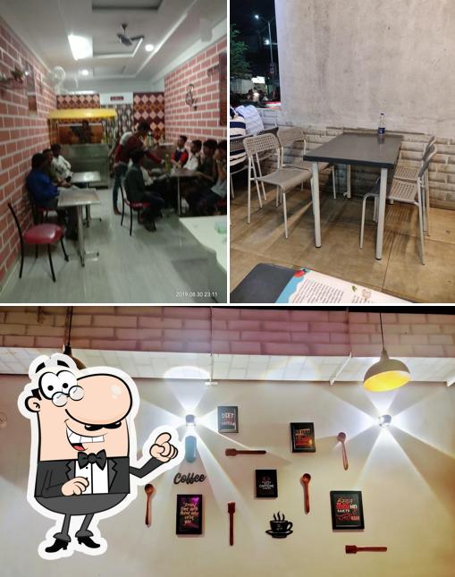 Take a seat at one of the tables at Amrut Cafe