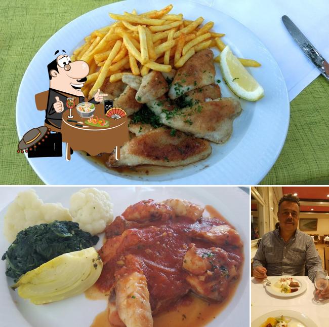 La immagine di cibo e tavolo da pranzo da Restaurant Räblus