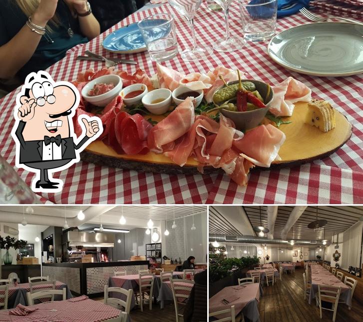 Siediti a un tavolo di Il Melograno Ristorante di Carne alla Griglia & Pizzeria