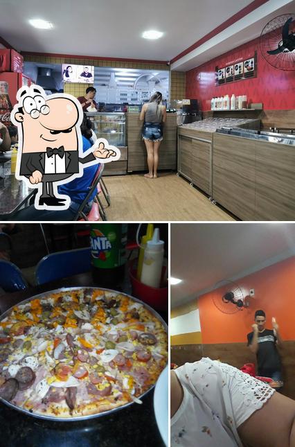 A imagem da interior e pizza no Anderson Lanches