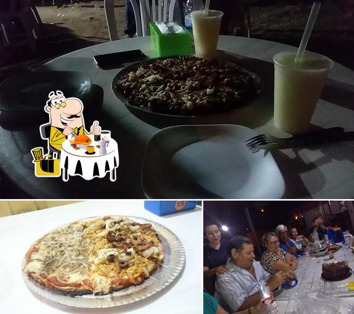 A foto da comida e mesa de jantar no Pizzaria Artesanal