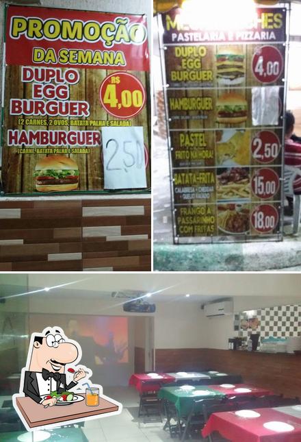 A imagem da comida e interior a Mega Lanches e Pizzaria