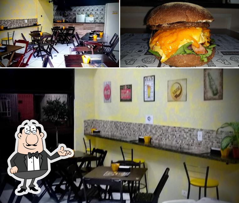 Esta é a imagem mostrando interior e cidadãos no Manollo’s Burger