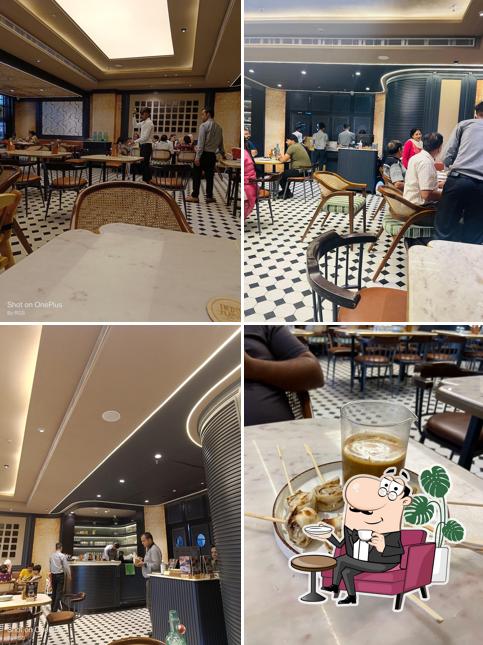 Take a seat at one of the tables at Indus Flavour Cross River Mall Karkardooma