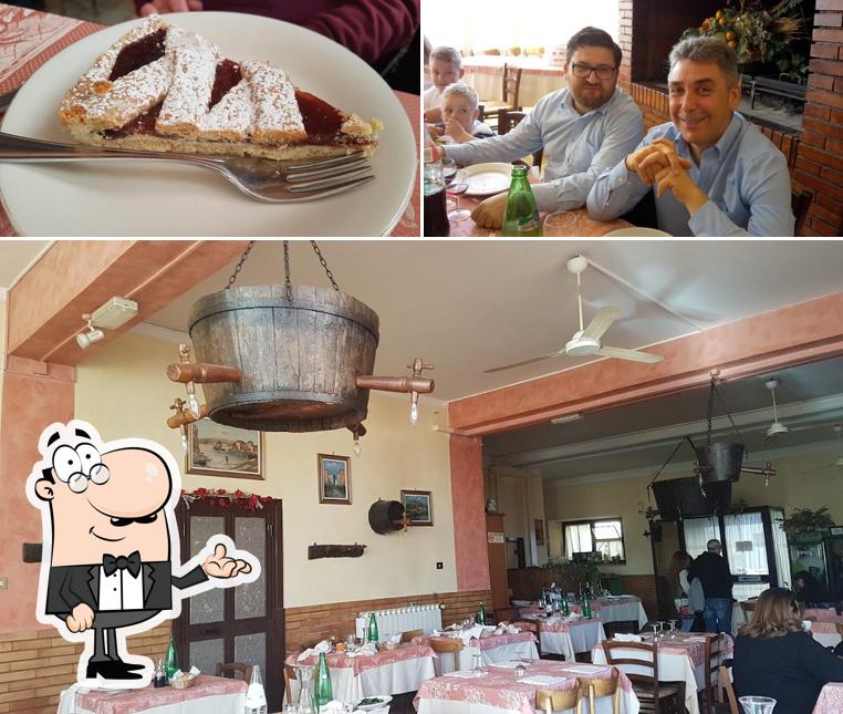 Questa è la foto che presenta la interni e torta di Trattoria Da Giglietto