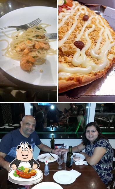 A imagem da comida e mesa de jantar no Mamma Mia Pizzaria & Gourmet