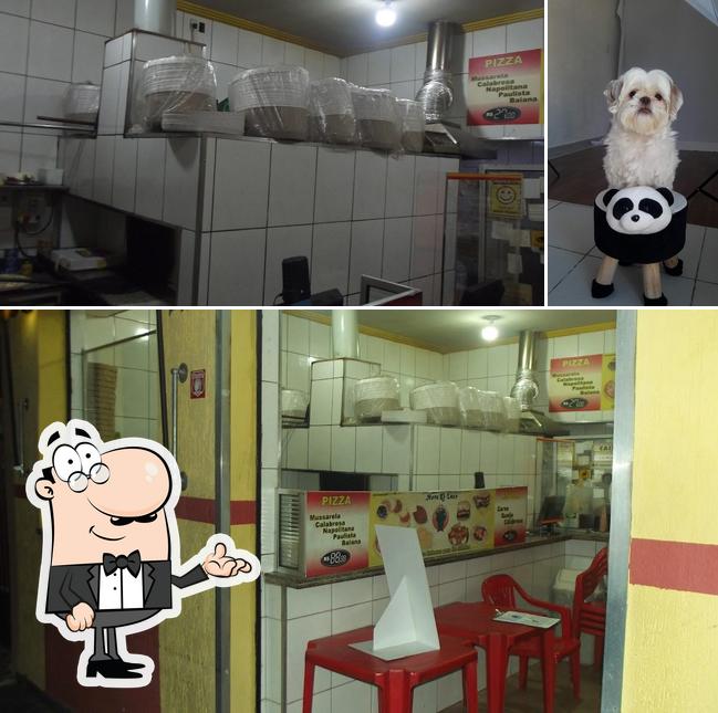 O interior do Pizzaria e Esfiharia Nova Ki-Luxo