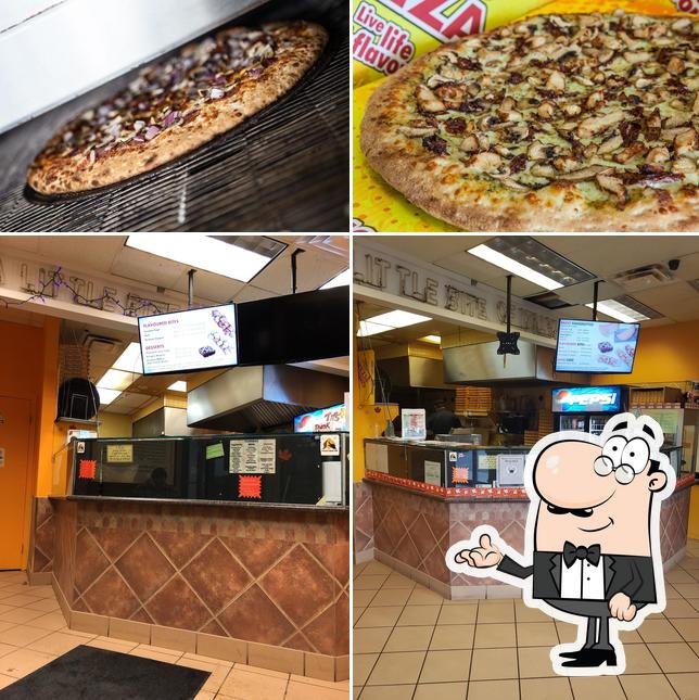 This is the photo displaying interior and food at Gino's Pizza