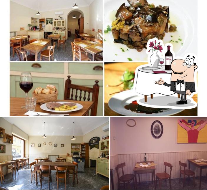 La foto di tavolo da pranzo e cibo da Trattoria La Via di Giulia