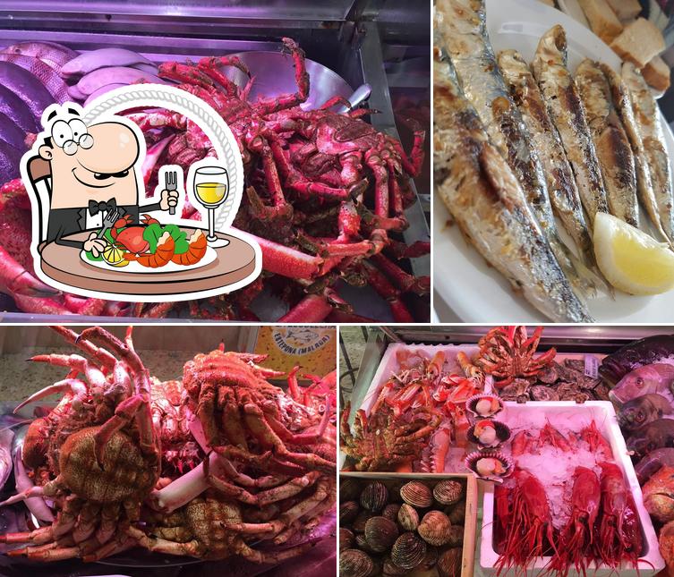 Get seafood at Restaurante La Escollera