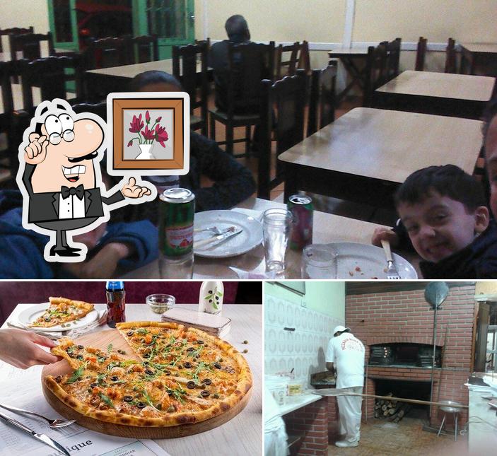 A imagem do Pizzaria Bona Notte’s interior e pizza